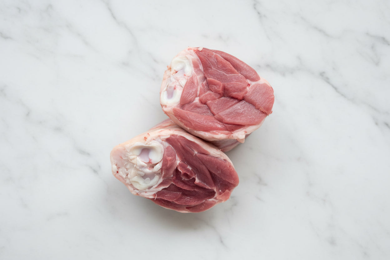 Two raw lamb shanks