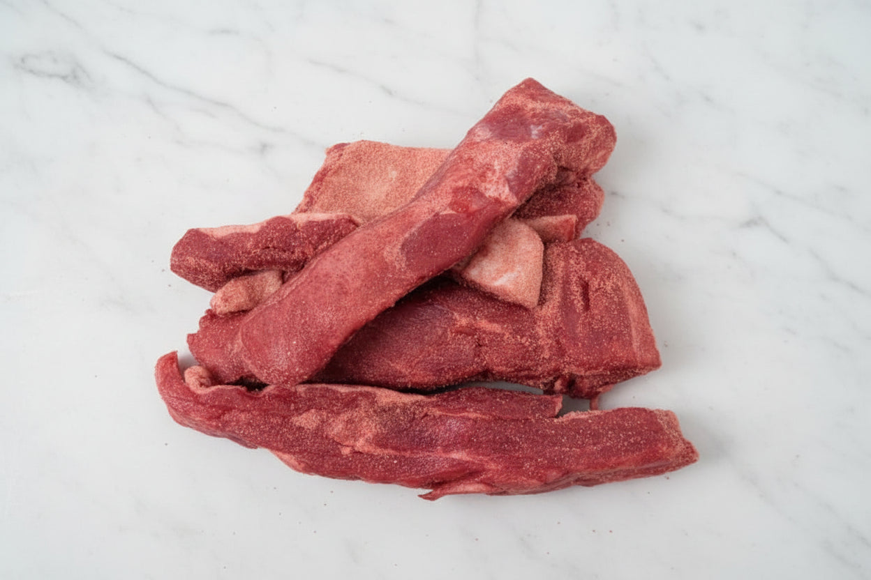 A pile of fresh pork spare ribs